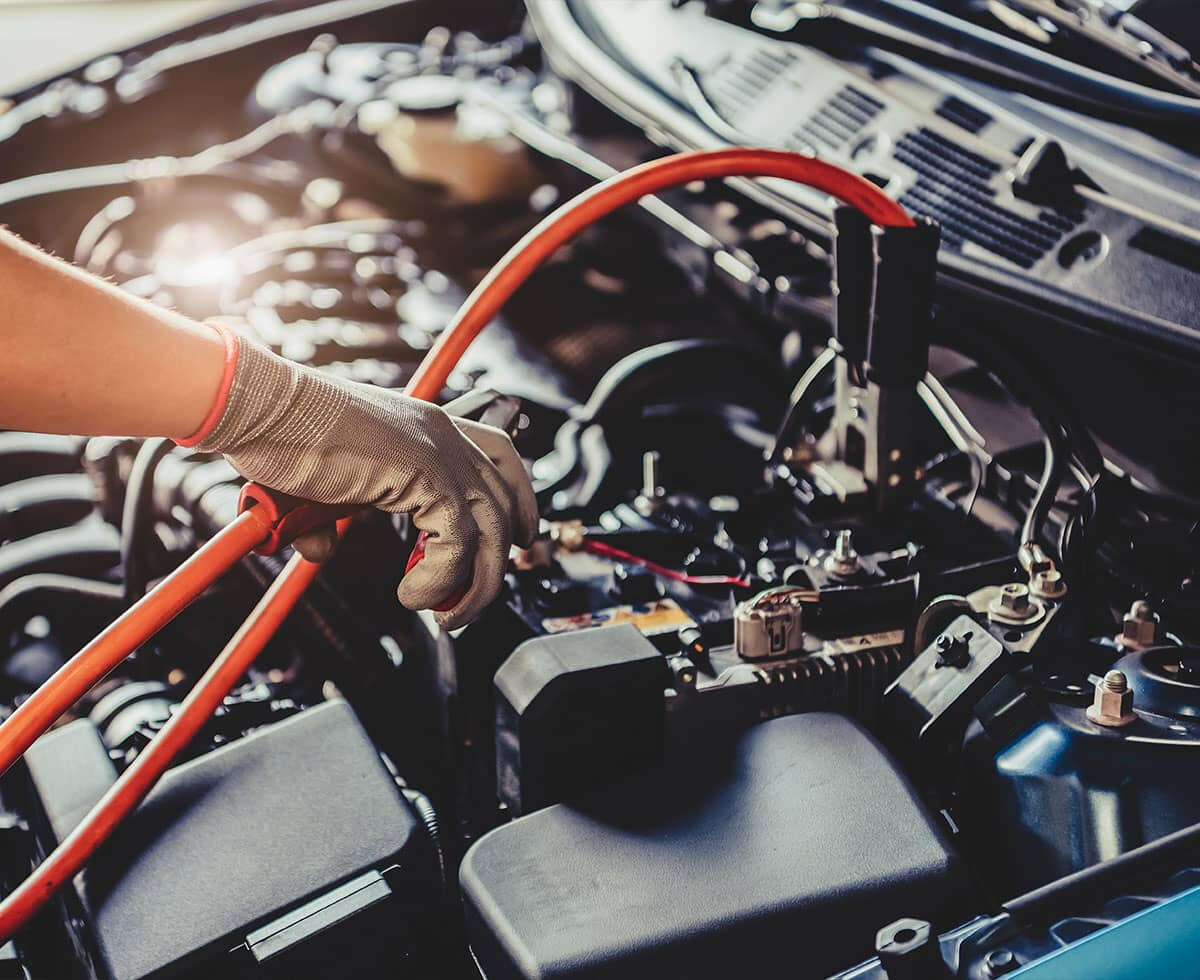 Technician performing auto electrical diagnostic and battery service at Gazy Auto Repair in Richmond Hill NY