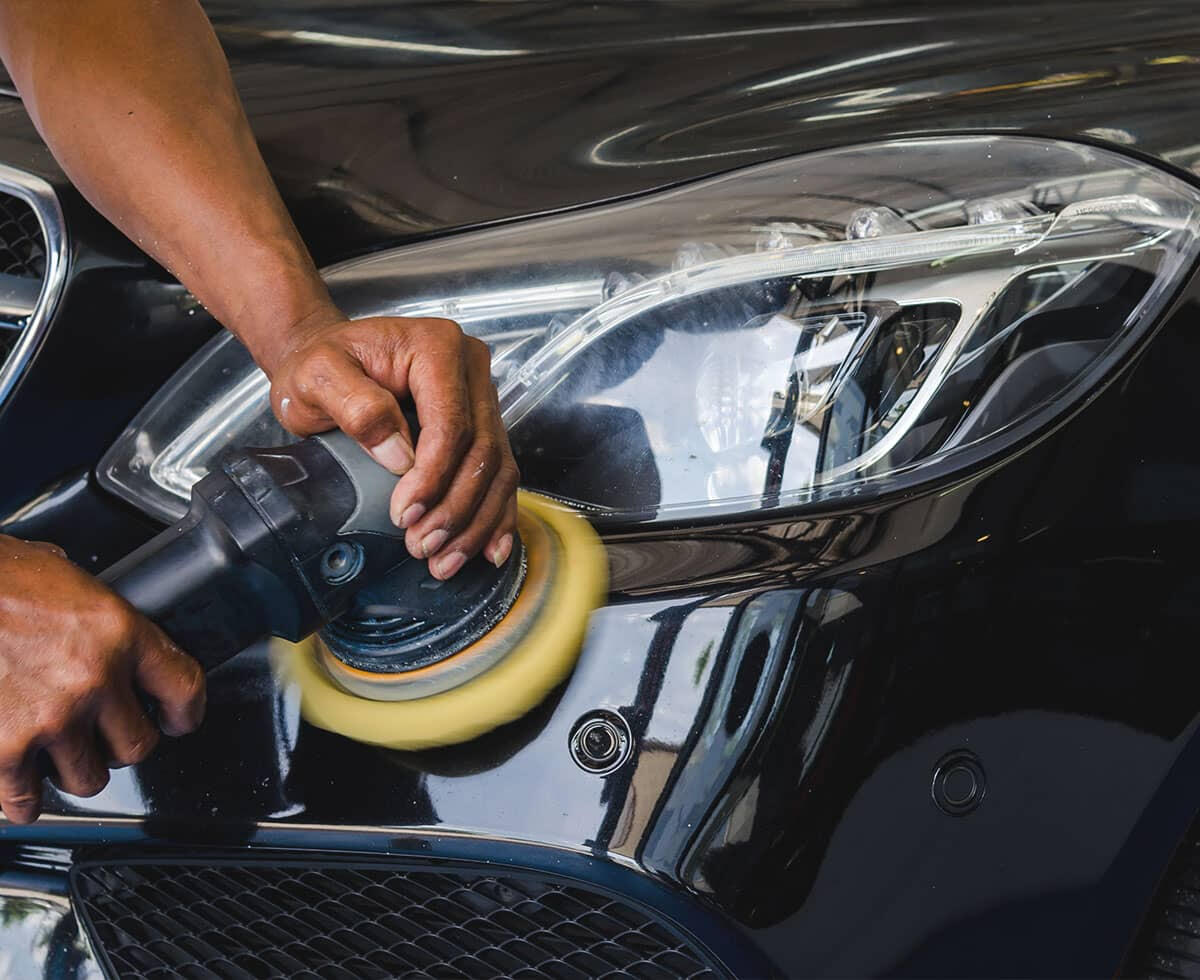 Technician performing collision and auto body repair refinishing service at Gazy Auto Repair in Richmond Hill NY